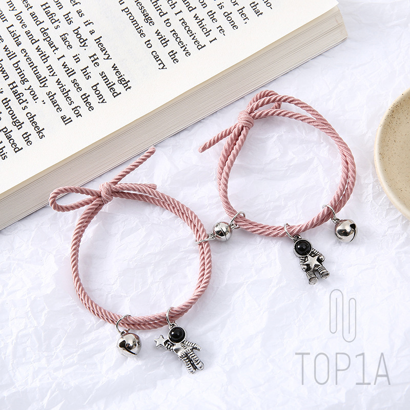 A pair of bracelets made with small rubber bands on white Stock Photo -  Alamy